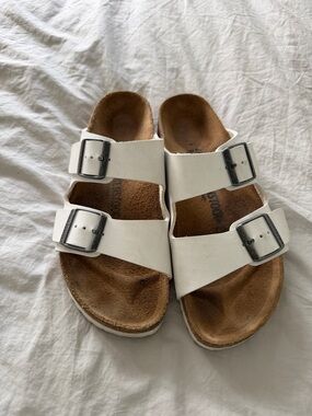Birkenstock White Arizona Two-Strap Sandals with Silver Buckles